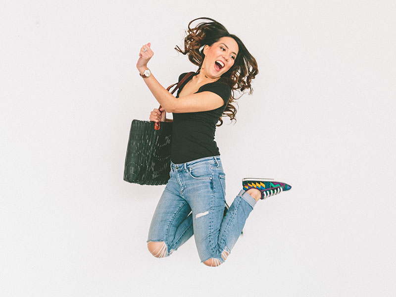 A woman who learned how to get over a guy jumping for joy and laughing in the air.