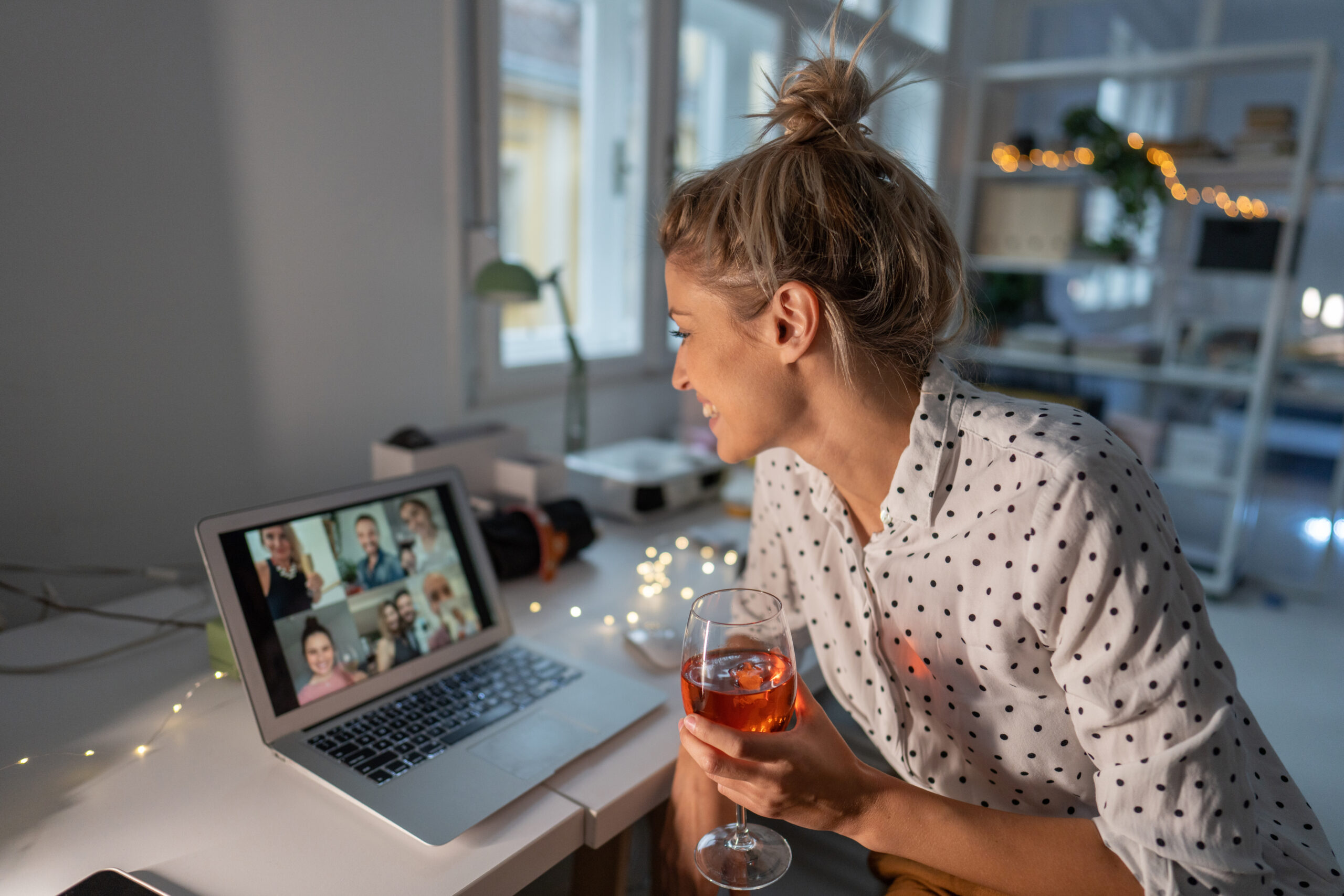 Young woman laughing and smiling while enjoying social dating with friends.